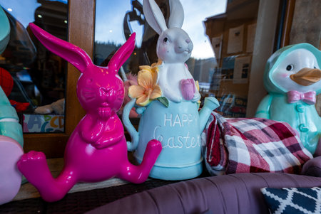 Easter window display with hot pink bunny and pastel rabbit can