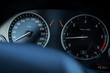 BMW X5 instrument cluster with speedometer, tachometer, and gear D