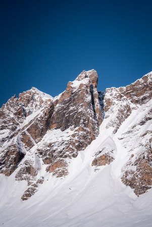Jagged alpine peak near San Domenico rises under a deep blue sky
