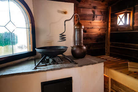 Alpine spa room with copper alembic still and stained glass window