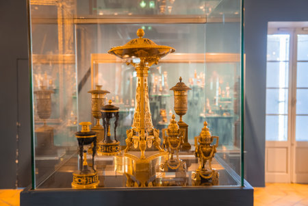 Gilded perfume burners and urns in a museum display, Grasse, France