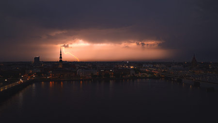 Aerial dusk thunderstorm over Riga Old Town and Daugava River