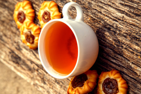 Homemade sweet cookies with tea. Delicious sweet cookies with tea on the table. Dessert cookies with tea in a cafe. The concept of desserts, sweets, coffee shop.の写真素材