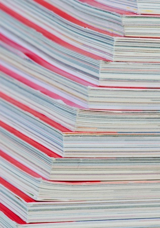 Stack of magazines with red cover