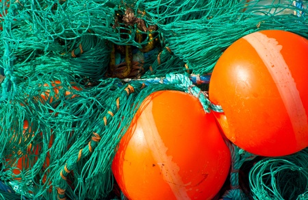 Fishing net and floats in fishing port Maasholm
