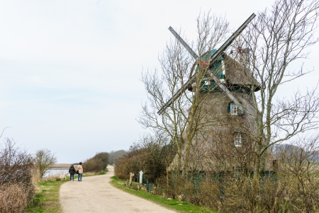 Thatched historic windmill Charlotte at the Geltinger Noorの写真素材
