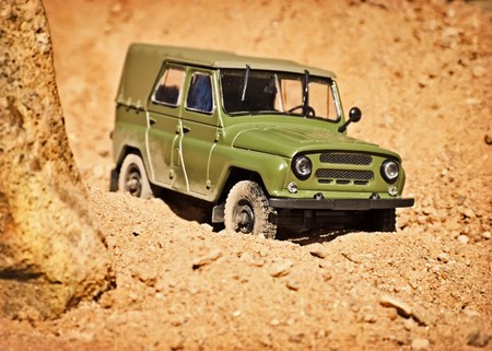toy military SUV in the desert, shallow depth of fieldの写真素材