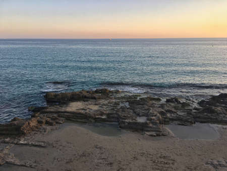 Mediterranean beach with no people at sunset. Calpe, Alicanteの写真素材