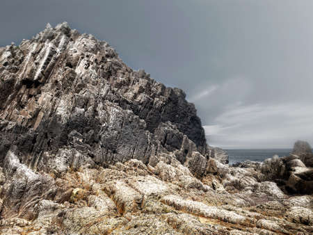 Rocks with straight edges at low tide of a beach on the asturian coast