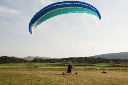 Moto paraglider on the fieldの写真素材