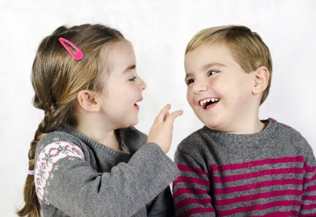 Portrait of a child, the love of brother and sister in his arms on a white background