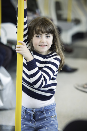 Little girl portrait standing in the subwayの写真素材