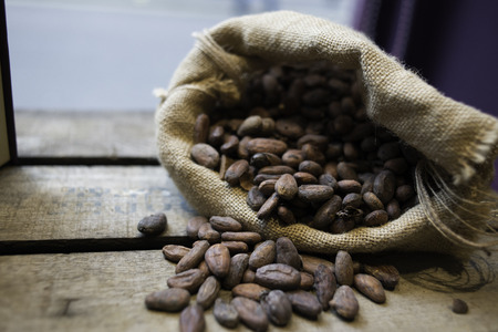 Cocoa textil sac over the wood in front of the windowの写真素材