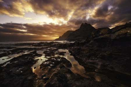 Colorful sunset over Punta del Hidalgo, Tenerife, Canary Islands, Spainの写真素材