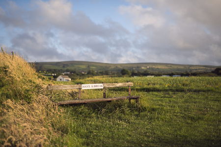 Bench with message in the coastline of Irelandの写真素材