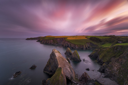 Sunset over the cliffs on the south of Cork, Irelandの写真素材