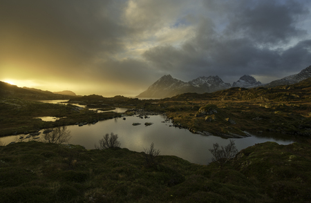 Colorful sunrise over a lake in Norway, Lofoten islandsの写真素材