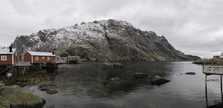 Red wooden cabins in a fisherman`s village in the fjiord, Norwayの写真素材