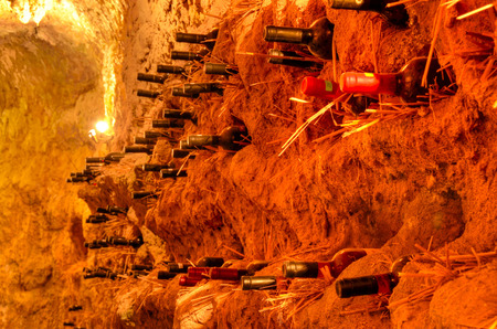 An old wine cellar with bottlesの写真素材