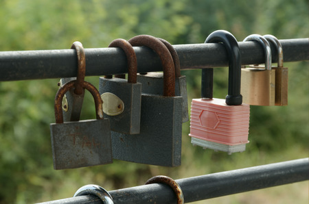 Rusty padlocks hang on sling love forever conceptの写真素材