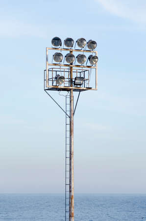 Spot light lamp system on blue sky background.