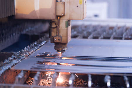 Laser machine cutting of metal sheet with sparks