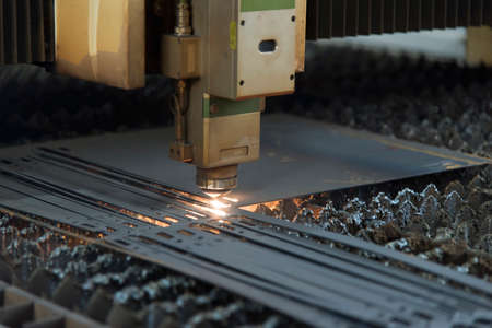 Laser machine cutting of metal sheet with sparks