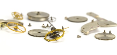 Clockwork details on a white paperの写真素材