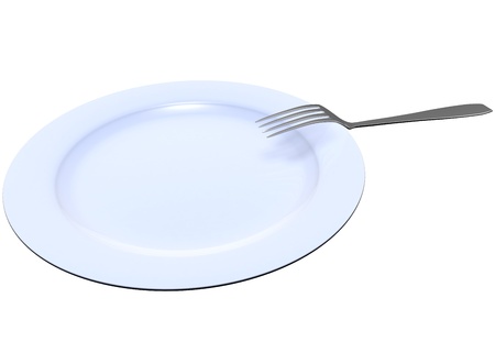 The fork lies on a dark blue plate on the white isolated backgroundの写真素材