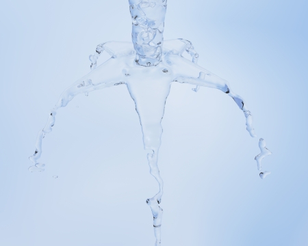 Abstract water fountain on a blue backgroundの写真素材