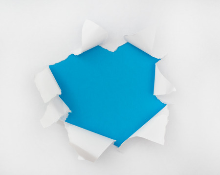 The torn white paper with an opening for a text or image insertの写真素材