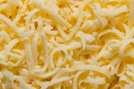 Background of the grated cheese in the macro scaleの写真素材