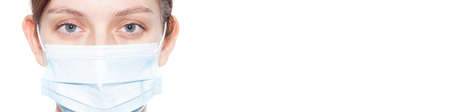 A girl in a medical mask. A banner on the topic virus. Isolated white background