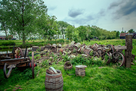 old oak barrels of beer were piled on the lawnの写真素材
