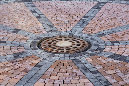 Manhole on paving tilesの写真素材