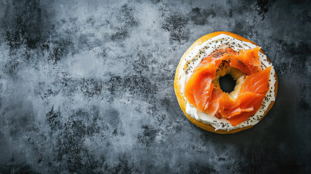 Top view of a New York-style bagel with cream cheese and lox. Copy space available.の素材