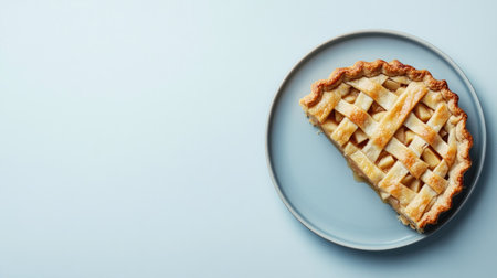 A tempting slice of apple pie rests on a plate, showcasing a perfectly baked crust and inviting filling. Ideal for culinary presentations and recipes.の素材