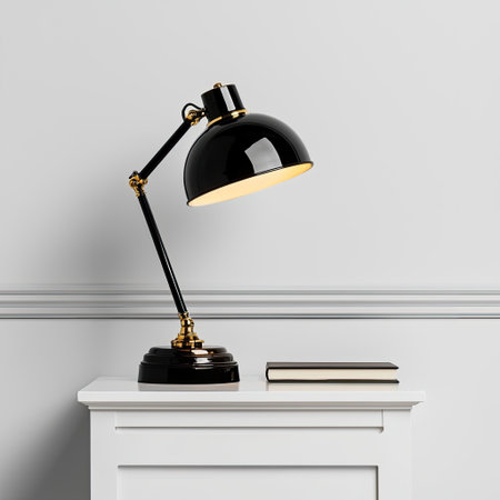 A chic black desk lamp casts a warm glow, enhancing a minimalist workspace. This elegant piece complements any office environment, ideal for reading or relaxing.の素材