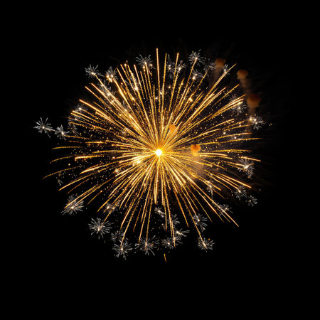 Captivating fireworks illuminate the night sky with an explosion of golden sparks and radiant light. Perfect for celebrating special events or holidays.の素材