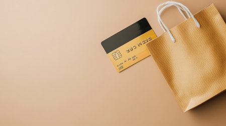 Isolated credit card and shopping bag on a neutral background with copy spaceの素材