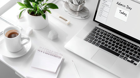 A stylish modern workspace featuring a laptop, fresh coffee, a notepad, and a green plant, ideal for productivity and minimalistic design inspiration.の素材