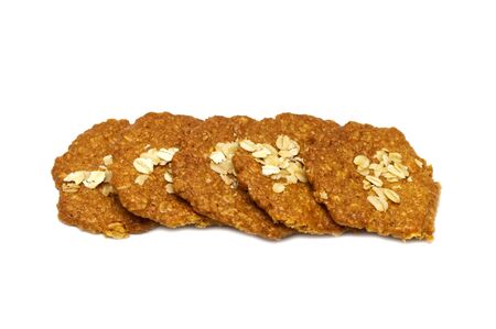 Biscuits homemade Oatmeal flavoured and Thin style. Stack of crunchy delicious sweet meal and useful cookies. Isolated on white background. の写真素材