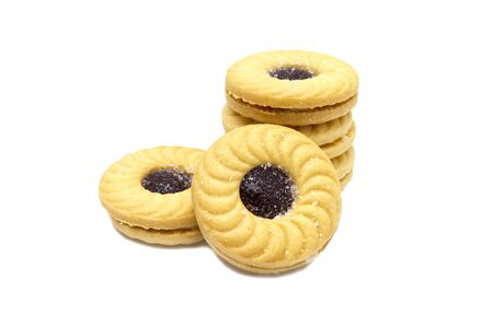 Biscuit sandwich butter cookies with cream and Blueberry flavoured jam. A stack of crunchy delicious sweet meal and useful cracker. isolated on white background. Soft focus.の写真素材