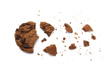 Chocolate chip cookies with broken and crumbs isolated on white background and Top view.