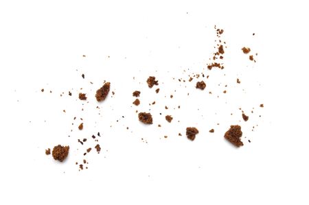 Scattered crumbs of chocolate chip cookies isolated on white background.の素材 [FY310144864145]