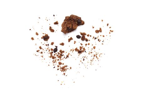 Cookies broken and crumbs of chocolate chip flavored isolated on white background.の写真素材