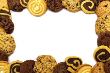 A group of assorted cookies. Chocolate chip, oatmeal, raisin, Coconut cream and biscuits in the shape of a spiral pattern isolated on white background and copy space.の写真素材
