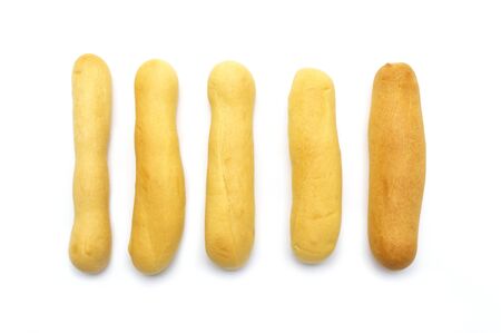 Rustic grissini bread sticks. Crispy straw biscuit isolated on white background.の写真素材