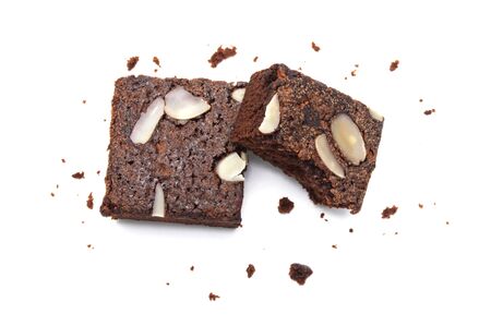 Chocolate brownie with sliced almond nuts toppings crumbs isolated on white background.の写真素材