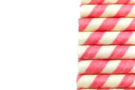 Pink stripe wafer rolls isolated on white background and copy space.の写真素材